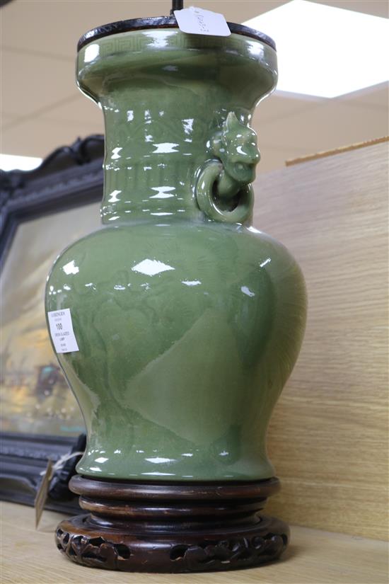 A Chinese celadon green glazed lamp